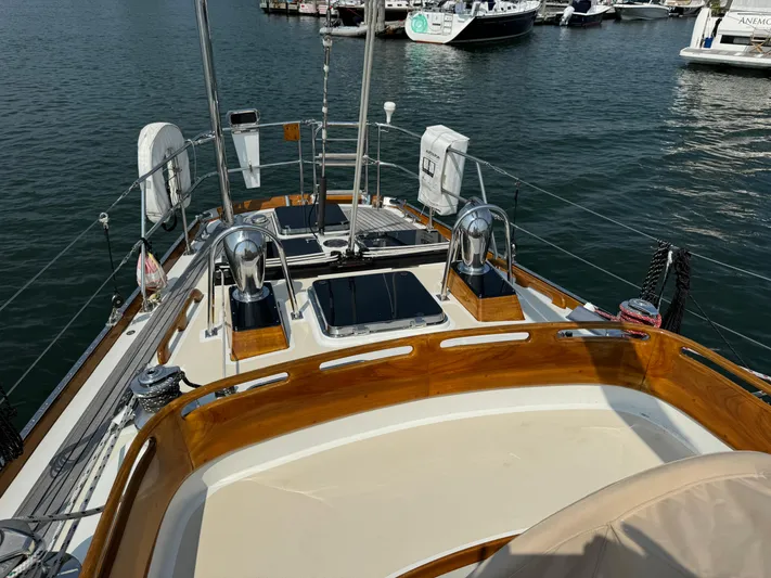 *previous Name Reserved Yacht Photos Pics 1986 Little Harbor 46 Center Cockpit sailboat docked in a marina, featuring polished wood accents.