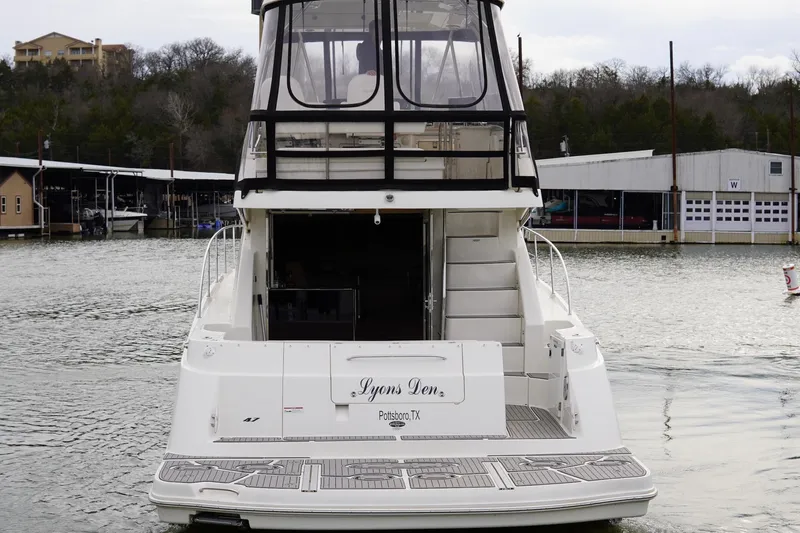  Yacht Photos Pics 2009 Sea Ray 47 Sedan Bridge yacht docked at marina, rear view.
