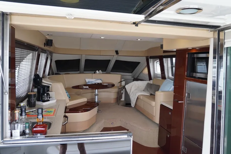  Yacht Photos Pics Luxurious interior of a 2009 Sea Ray 47 Sedan Bridge yacht with elegant seating and amenities.