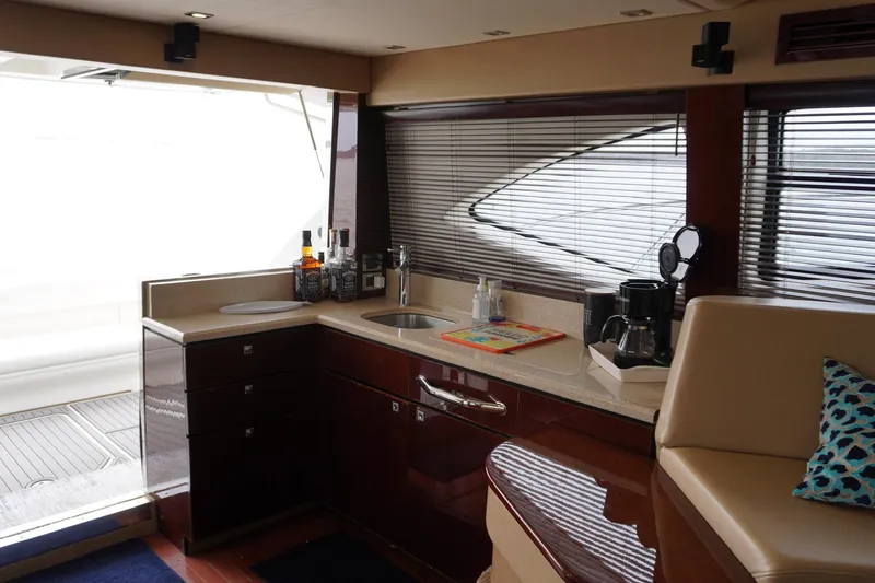  Yacht Photos Pics Luxurious interior of 2009 Sea Ray 47 Sedan Bridge yacht with modern kitchen amenities.