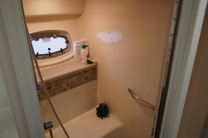  Yacht Photos Pics Shower area in 2009 Sea Ray 47 Sedan Bridge yacht with porthole and toiletries.