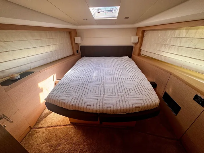 Pure Yacht Photos Pics Luxurious cabin interior of a 2016 Prestige 500 yacht with a comfortable bed.