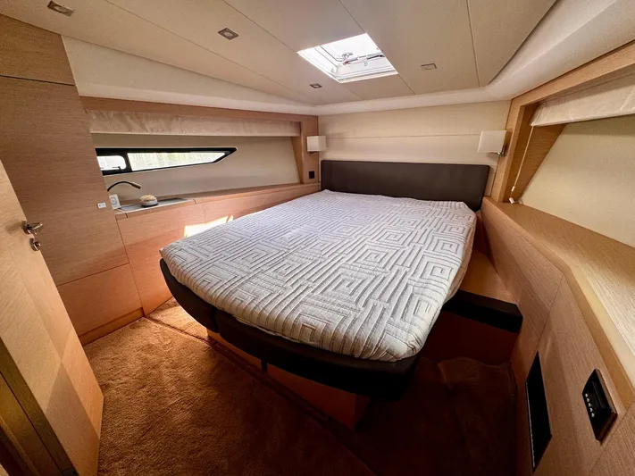 Pure Yacht Photos Pics Luxurious cabin interior of a 2016 Prestige 500 yacht with a comfortable bed.