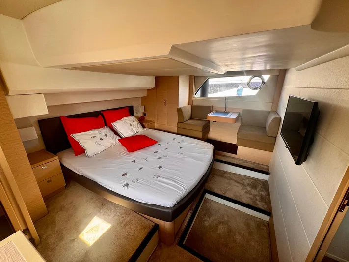 Pure Yacht Photos Pics Luxurious cabin interior of a 2016 Prestige 500 yacht with bed, seating, and TV.