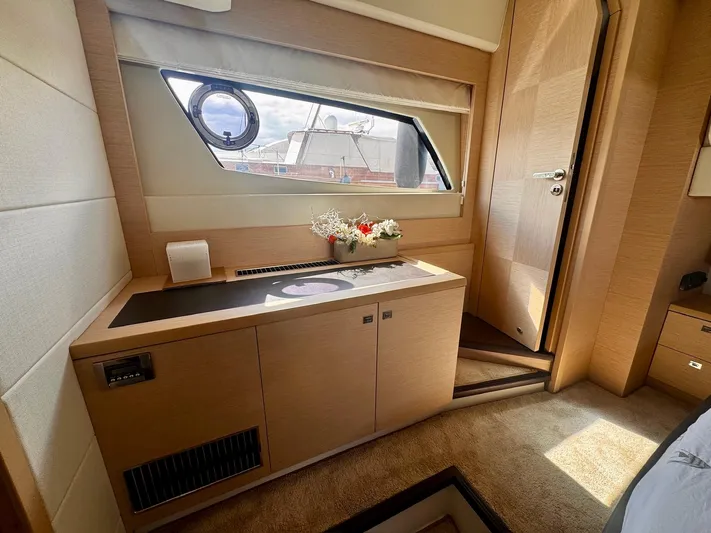 Pure Yacht Photos Pics Luxurious interior of 2016 Prestige 500 yacht with elegant wood finish and window view.