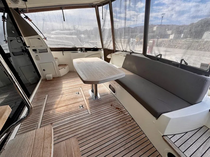 Pure Yacht Photos Pics Prestige 500 yacht interior, 2016 model, featuring a spacious seating area with wooden flooring.