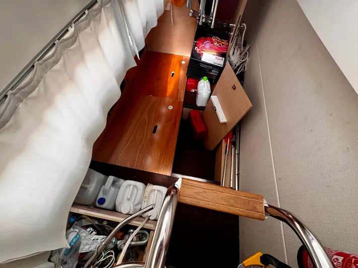 Pure Yacht Photos Pics Storage area inside a 2016 Prestige 500 yacht with various supplies and equipment.