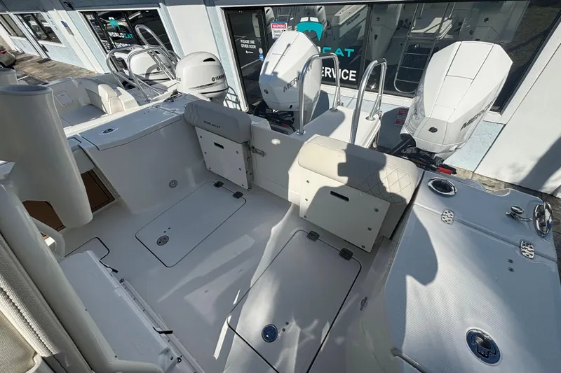  Yacht Photos Pics 2026 World Cat 265 CC-X boat interior with dual outboard motors, spacious deck, and seating.
