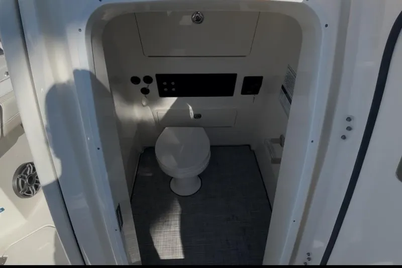  Yacht Photos Pics Interior of 2026 World Cat 265 CC-X boat featuring a compact marine toilet.