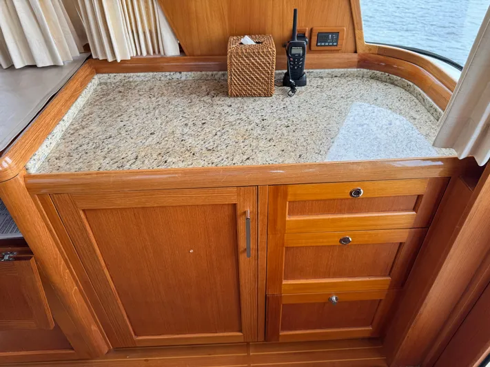 Hezitation Yacht Photos Pics Granite countertop and wooden cabinetry inside 2009 Grand Banks 45 Eastbay SX yacht.