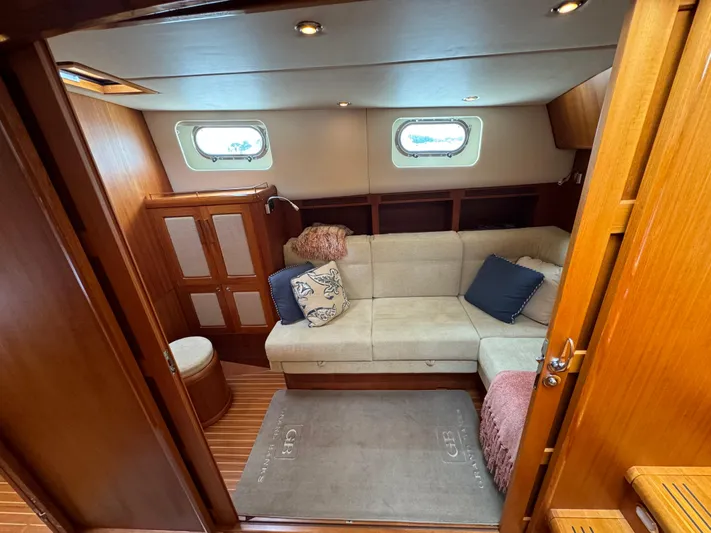 Hezitation Yacht Photos Pics Luxurious interior of 2009 Grand Banks 45 Eastbay SX yacht with cozy seating area.