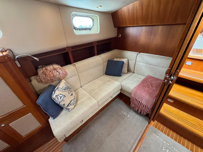 Hezitation Yacht Photos Pics Luxurious interior of 2009 Grand Banks 45 Eastbay SX yacht with cozy seating area.