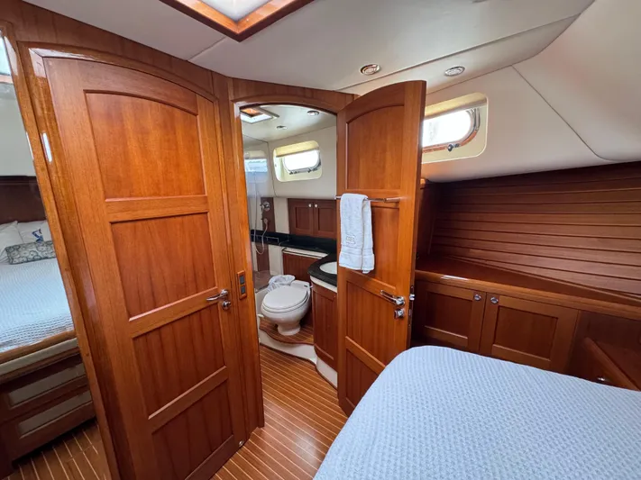 Hezitation Yacht Photos Pics Luxurious 2009 Grand Banks 45 Eastbay SX yacht interior with wood finish and cozy cabin.
