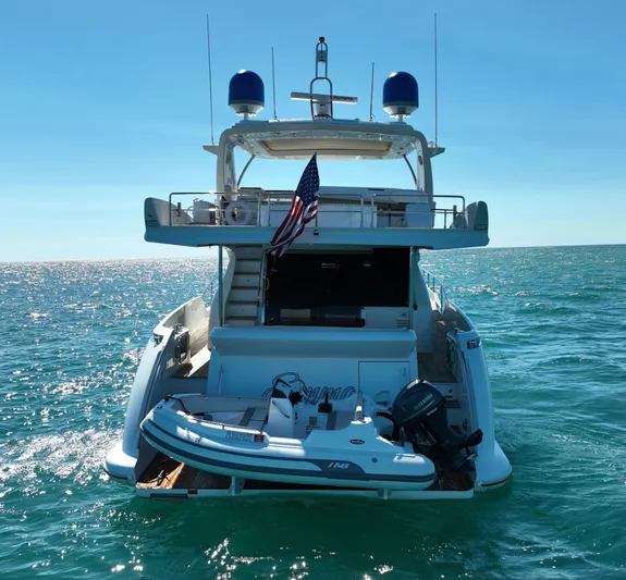 Emma Yacht Photos Pics Azimut 70 yacht from 2014 on open water, featuring a small boat on the deck.