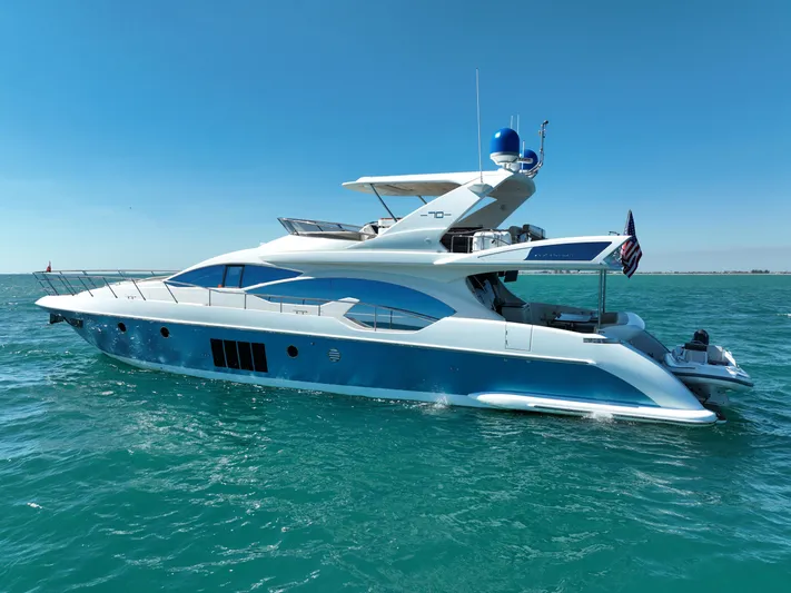Emma Yacht Photos Pics Luxury 2014 Azimut 70 yacht cruising on clear blue waters under a sunny sky.