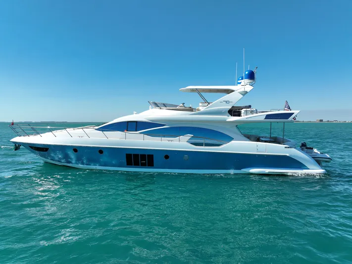 Emma Yacht Photos Pics Luxury 2014 Azimut 70 yacht cruising on clear blue waters.