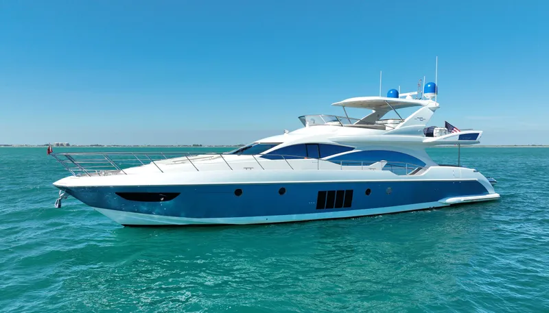 Emma Yacht Photos Pics Luxury 2014 Azimut 70 yacht cruising on clear blue waters.