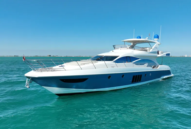 Emma Yacht Photos Pics Luxury 2014 Azimut 70 yacht cruising on clear blue waters.