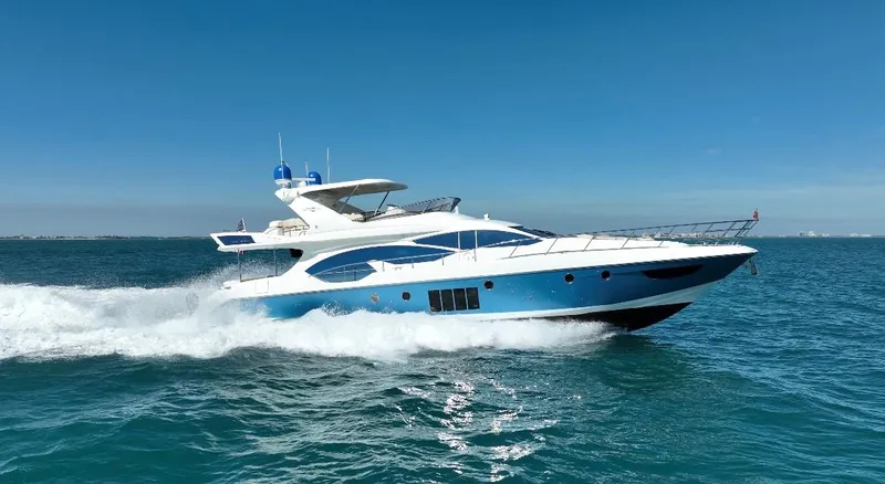 Emma Yacht Photos Pics 2014 Azimut 70 yacht cruising on open water under clear blue skies.