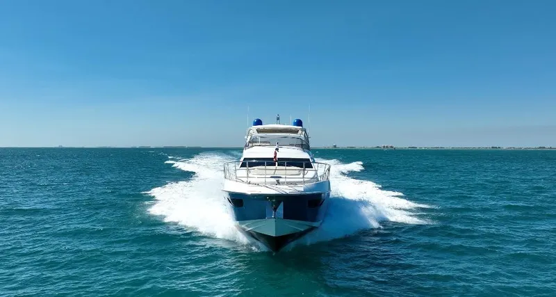 Emma Yacht Photos Pics Azimut 70 yacht cruising on open sea, 2014 model, clear blue sky.