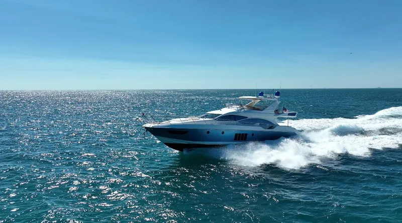 Emma Yacht Photos Pics Azimut 70 yacht cruising on open sea, 2014 model, under clear blue sky.