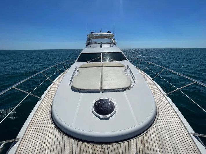 Emma Yacht Photos Pics 2014 Azimut 70 yacht cruising on open sea under clear blue sky.