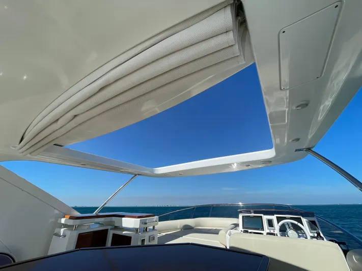 Emma Yacht Photos Pics Luxurious 2014 Azimut 70 yacht interior with open sunroof and ocean view.