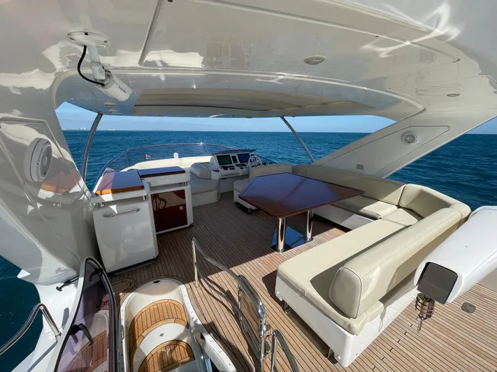 Emma Yacht Photos Pics Luxurious 2014 Azimut 70 yacht interior with elegant seating and ocean view.