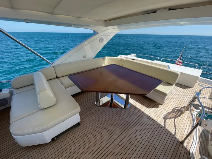 Emma Yacht Photos Pics Luxurious 2014 Azimut 70 yacht deck with elegant seating and ocean view.