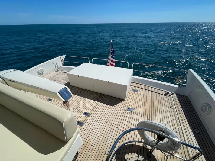 Emma Yacht Photos Pics 2014 Azimut 70 yacht deck with seating, ocean view, and American flag.