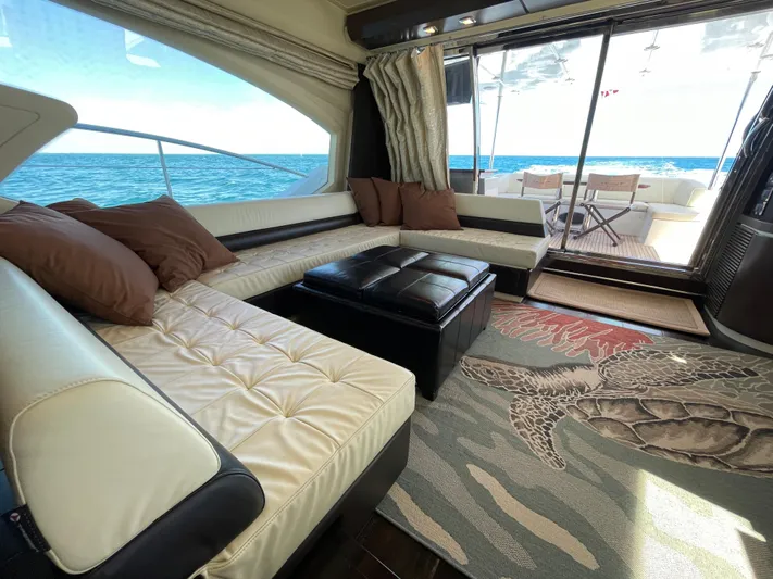 Emma Yacht Photos Pics Luxurious interior of 2014 Azimut 70 yacht with ocean view and elegant seating area.