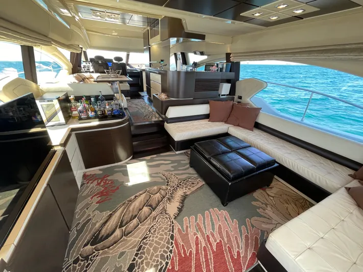 Emma Yacht Photos Pics Luxurious interior of a 2014 Azimut 70 yacht with elegant seating and ocean view.