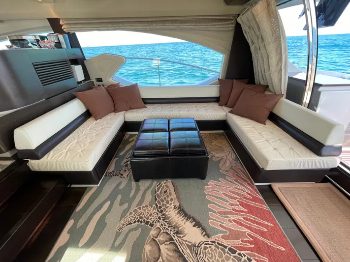 Emma Yacht Photos Pics Luxurious interior of a 2014 Azimut 70 yacht with ocean view and elegant seating.