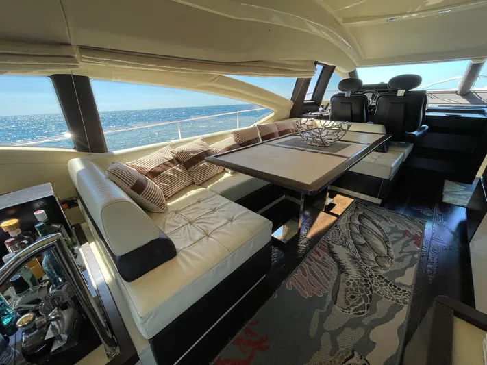 Emma Yacht Photos Pics Luxurious interior of a 2014 Azimut 70 yacht with elegant seating and ocean view.