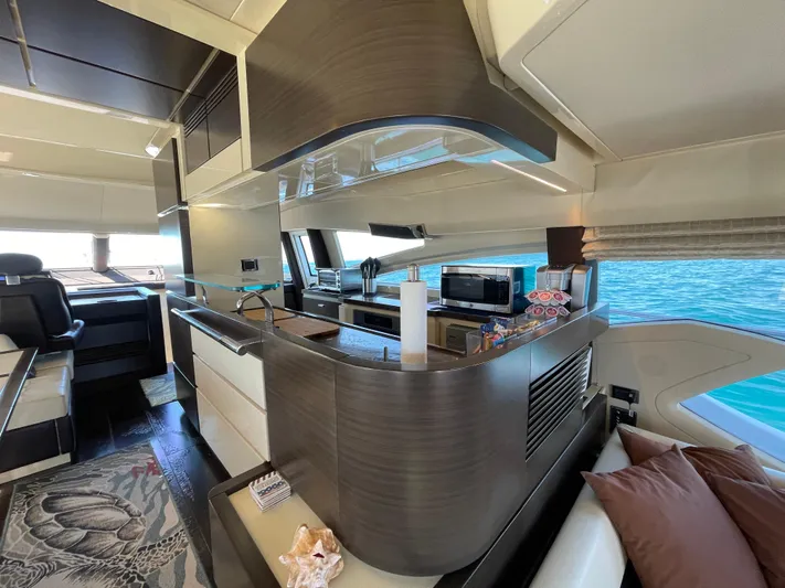 Emma Yacht Photos Pics Luxurious interior of a 2014 Azimut 70 yacht with modern kitchen and ocean view.