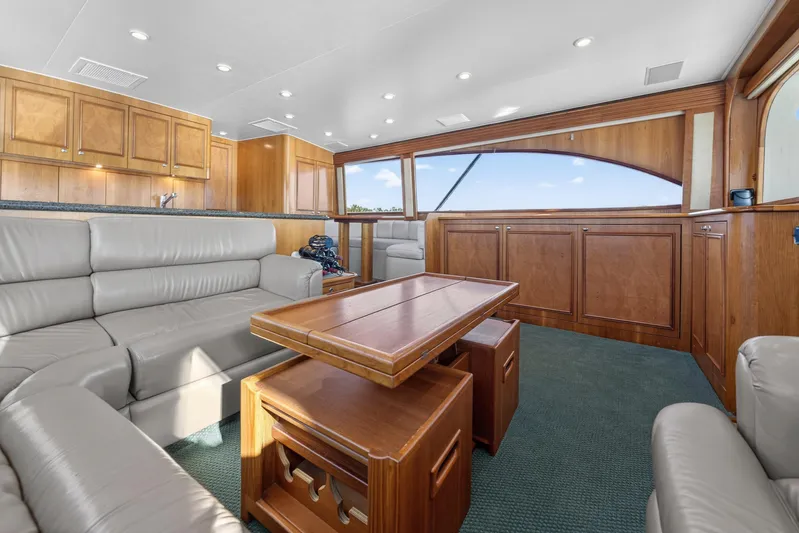 Cherin III Yacht Photos Pics Salon with high low table, and wrap around couch with underseat storage