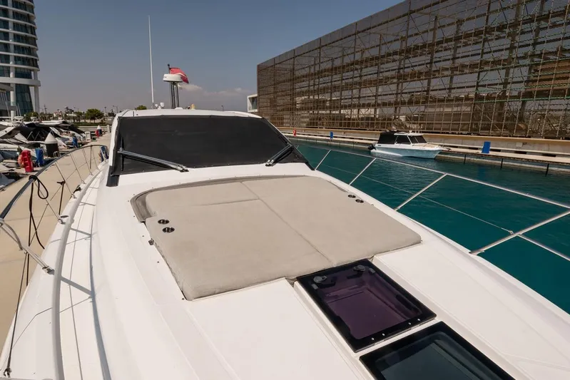 Rogue 33 Yacht Photos Pics 2019 Azimut Atlantis 51 yacht docked in a marina, showcasing sleek design and luxury features.