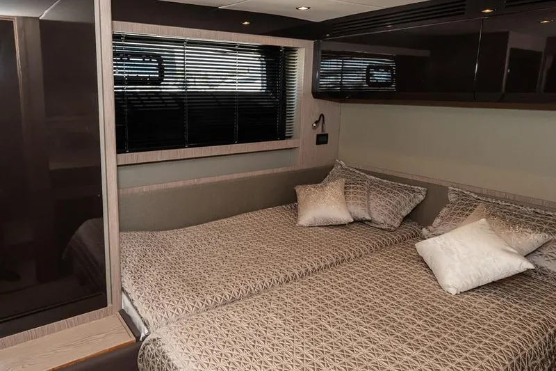 Rogue 33 Yacht Photos Pics Luxurious bedroom interior of 2019 Azimut Atlantis 51 yacht with elegant bedding.