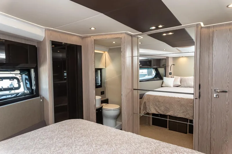 Rogue 33 Yacht Photos Pics Luxurious interior of 2019 Azimut Atlantis 51 yacht with modern bedroom and bathroom.