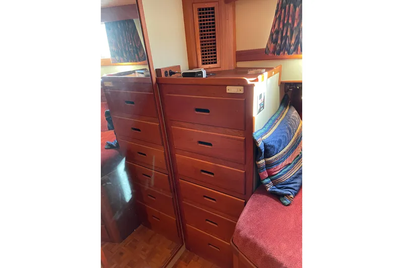 Daddy's Dream Yacht Photos Pics Interior of 1991 Grand Banks 46 Motoryacht with wooden drawers and colorful cushions.