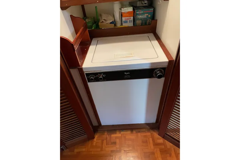 Daddy's Dream Yacht Photos Pics Laundry area with Whirlpool appliance on 1991 Grand Banks 46 Motoryacht.