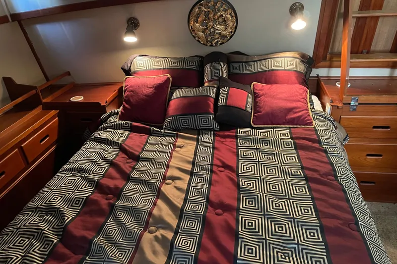 Daddy's Dream Yacht Photos Pics Luxurious bedroom interior of 1991 Grand Banks 46 Motoryacht with geometric bedding design.