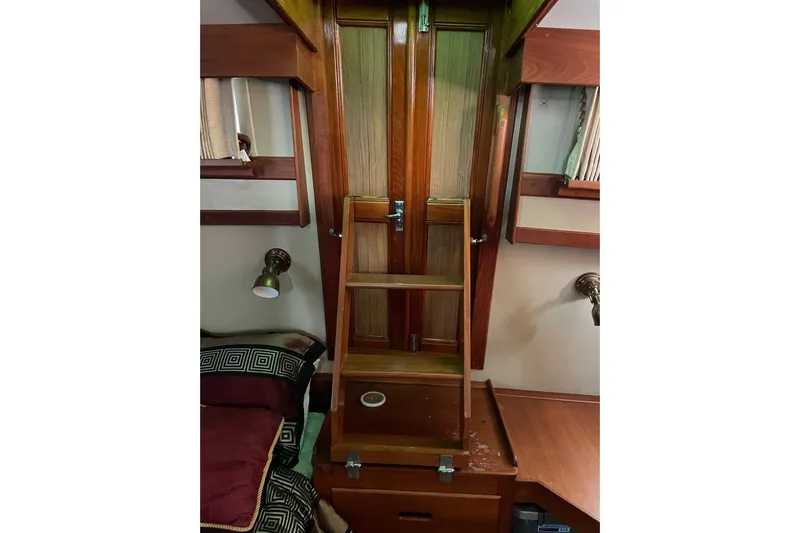 Daddy's Dream Yacht Photos Pics Interior of 1991 Grand Banks 46 Motoryacht with wooden ladder and cozy cabin features.