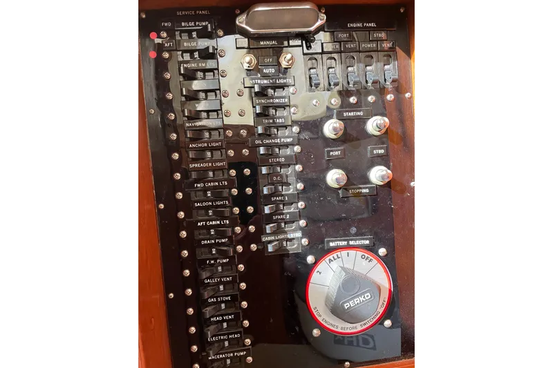 Daddy's Dream Yacht Photos Pics Control panel of a 1991 Grand Banks 46 Motoryacht with labeled switches and battery selector.