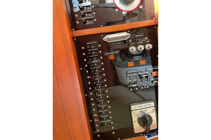 Daddy's Dream Yacht Photos Pics Control panel of a 1991 Grand Banks 46 Motoryacht, featuring various switches and indicators.