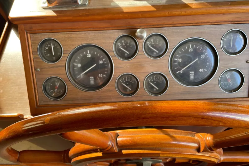 Daddy's Dream Yacht Photos Pics Wooden helm and gauges of a 1991 Grand Banks 46 Motoryacht.