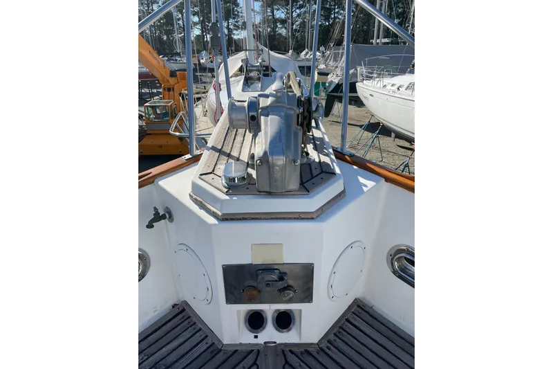 Daddy's Dream Yacht Photos Pics 1991 Grand Banks 46 Motoryacht deck with winch and railing, docked in marina.