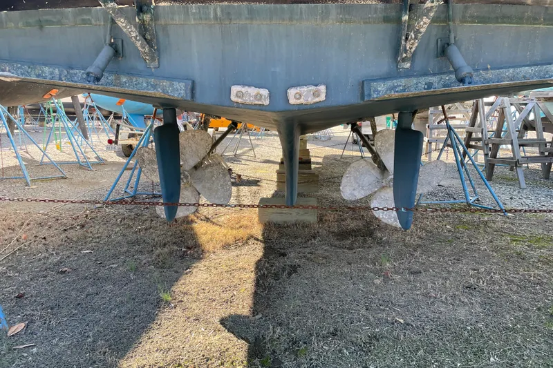 Daddy's Dream Yacht Photos Pics Underside view of 1991 Grand Banks 46 Motoryacht with visible propellers and rudders.