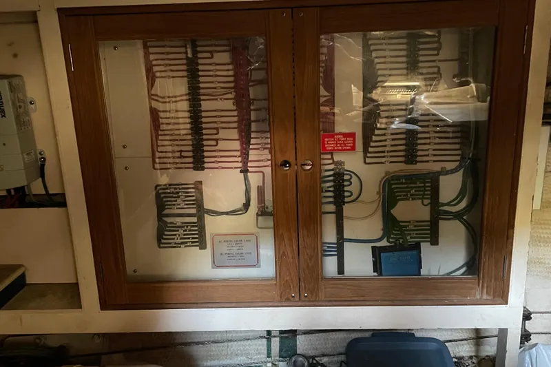 Daddy's Dream Yacht Photos Pics Electrical panel inside a 1991 Grand Banks 46 Motoryacht, showcasing wiring and components.