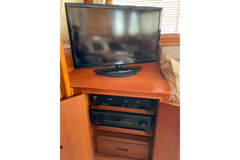Daddy's Dream Yacht Photos Pics Entertainment center with TV and audio equipment on 1991 Grand Banks 46 Motoryacht.